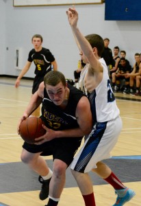 Westfield Tech’s Tyler French makes an aggressive move toward the hoop. (Photo by Chris Putz)