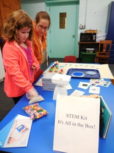 Jordan, 7 and Aimee Bell try out the weights and measures in one of the new STEM kits at the Westfield Athenaeum.