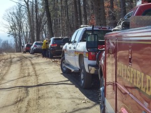 Smoke can be scene in the distance at the command center set up on Pitcher Road to fight the 70-acre brush fire on Tekoa Mountain. (Photo by Christine Charnosky)