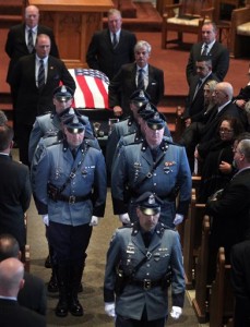 State Troopers precede the casket of Trooper Thomas L. Clardy as they leave Saint Michael's Church after his funeral service on Tuesday,March 22, 2016 in Hudson, Mass. Clardy, was killed when a car slammed into his cruiser as he was stopping another driver. (Nancy Lane/The Boston Herald via AP, Pool)