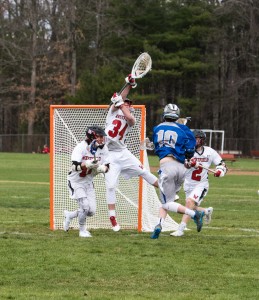 Westfield goalie Matthew Reynolds makes a leaping save against Central Valley in Saturday's high school boys' lacrosse game in the Whip City. (Photo by Bill Deren)