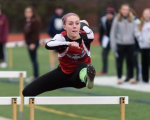 Westfield's Morgan Sanders clears the hurdle as she leads the pack in the 100 meters Friday at Chicopee High School. (Photo by Marc St. Onge)