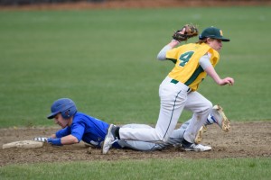 St. Mary's Matt Masciadrelli (4) attempts to make the play as a Granby baserunner slides into the base Saturday at Westfield Middle School North. (Photo by Marc St. Onge)