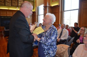 Mary Jane Stec receives a Volunteer of the Year award from Westfield Mayor Brian Sullivan. Stec volunteers her time at the Southampton Road School.