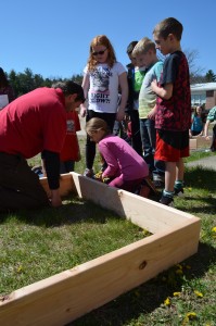 David Dion explains the first step of building the raised garden.