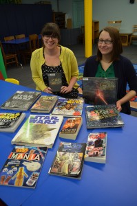 Liz Cashman, head of the Westfield Athenaeum's reference department, and Jessica Blasko, head of youth services, are planning a Stars War Day on May 4.