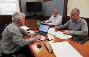 Ward 5 City Councilor and Finance Committee Chair Robert A. Paul (center) and At-Large Councilor Matthew T. VanHeynigan (right) heard from City Planner Joe Mitchell before voting to approve funds transfer that take the Elm Street Urban Renewal Plan one more step forward. (Photo by Amy Porter)