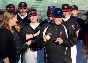 Westfield athletic director Eileen Flaherty presents Westfield High School boys’ varsity baseball head coach Rich Discenza with a game ball after collecting his 200th career victory Thursday. (Photo by Chris Putz)