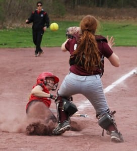 Westfield's Casey Almeida slides safely into home plate against visiting Ludlow Monday. (Photo by Kellie Adam)