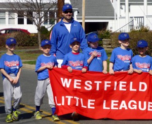 Westfield Little Leaguers walk the city street during a parade celebrating Little League Opening Day in 2015. This year's Opening Day festivities will be held Saturday. (Staff photo)
