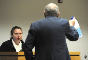 Attorney Thomas D. Whitney shows his client, Jennifer Gingras of Holyoke, a bottle of bleach as he questions during her trial on a charge of cruelty to an animal in Westfield District Court last week. Gingras was found guilty of dousing her boyfriend’s dog with bleach. (Photo ©2016 Carl E. Hartdegen)