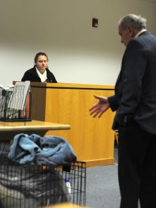 Attorney Thomas D. Whitney refers to a crate in which a dog was confined when it was soaked with bleach as he questions his client, Jennifer Gingras of Holyoke, during her trial on a charge of cruelty to an animal in Westfield District Court last week. Gingras was found guilty of the crime. (Photo ©2016 Carl E. Hartdegen)
