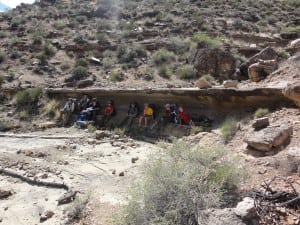 Troop 109 resting under a natural "dugout" in the Grand Canyon.