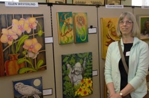 Local artist Ellen Westerlind shows her gallery during Westfield's "Articulture" event on Saturday. (Photo by Lynn Boscher)