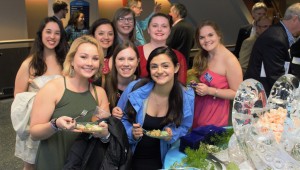 AcaOwlettes (all female acapella group) check out the refreshments (Photo by Lynn Boscher)