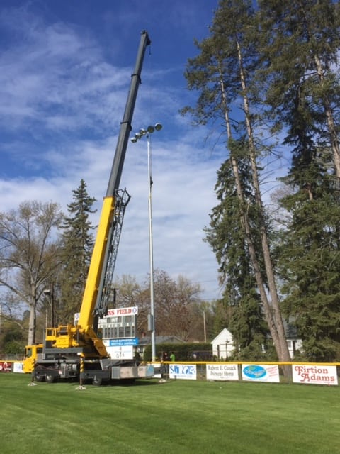 The first of several new state-of-the-art LED light poles is installed last week at Bullens Field as part of the ongoing renovation project in preparation for the Babe Ruth 14-Year-Old World Series Aug. 9-19. (Submitted photo)