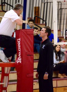 Westfield High School boys' volleyball head coach Tyler Wingate has a brief discussion with an official at the side of the net during a match earlier this season. Wingate celebrated his 100th career victory Thursday against Chicopee Comp. (Photo by Chris Putz)