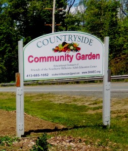 A sign on Route 20 in Russell for the Countryside Community Garden. (Photo by Amy Porter)