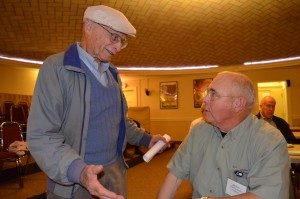 Henry Warchol was recognized for his decades of service during the annual meeting of the Westfield River Watershed Association meeting on Thursday night. Warchol, on left, makes a point to Bill Rose, president, prior to the meeting.