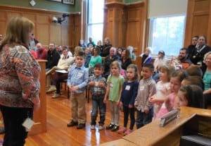 Fort Meadow pre-school teacher Aimee Blair leads students in a song about Lively Letters at the School Committee meeting on Monday, (Photo by Amy Porter)