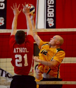 Southwick’s Jack Lebo (right) attempts to elevate high above the Athol defense in Thursday’s Western Massachusetts Division 1 high school boys’ volleyball tournament opener. (Photo by Chris Putz)