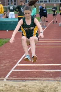 Southwick's Melanie Desroches jumps for distance Monday. (Photo by Lynn Boscher)