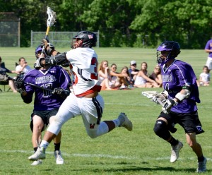 Westfield’s Chris Ward, center, finds a crease in the heart of the Pittsfield defense for a shot. (Photo by Chris Putz)