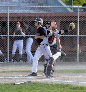 Austin St. Pierre crosses home plate for the Bombers behind the Pope Francis Cardinals' catcher Friday night at Bullens Field. (Photo by Lynn Boscher)