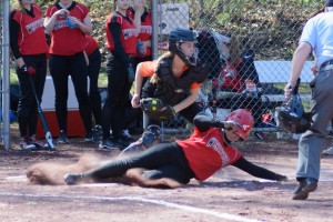 The Bombers slide past the Orioles in high school softball action Monday at Westfield High. (Photo by Marc St. Onge)