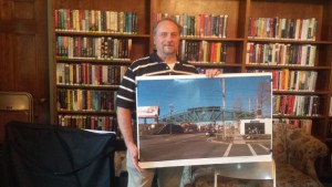 Westfield city engineer Mark Cressotti displays Main St. bridge plans at Anthenaeum library.