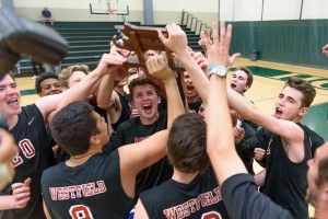 The Westfield Bombers celebrate a Western Massachusetts Division 1 boys' volleyball championship Monday night with a 3-1 win over Central at Holyoke Community College. (Photo by Marc St. Onge)