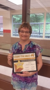 Jeannine Johnson poses with her award. 