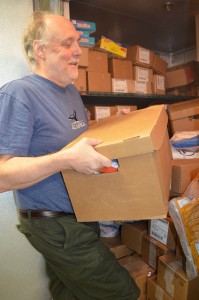 Volunteer Robert Bristow sorts items in the Westfield Food Pantry freezer Friday morning.