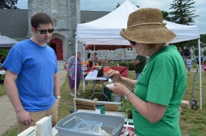 Isaac Stayton, a chemistry professor at Western New England University, brought some soil samples to have tested by Master Gardener Judith Harvester of the Western Massachusetts Master Gardener Association at the Westfield Farmers' Market on Thursday afternoon. 