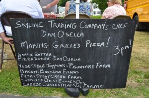 Every Thursday at the Westfield Farmers' Market, a different chef prepares a specialty from ingredients found at the tables of the market's participants.  On Thursday, chef Dan Osella of the Skyline Trading Company in Westfield explained to hungry patrons how to make grilled pizza. The board showcases the featured items on the pizza.