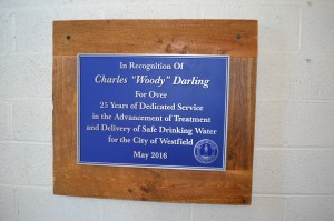 A plaque now graces the walls of the water division's headquarters on Sackett Street for Charles "Woody" Darling who was feted at a retirement luncheon on Friday.