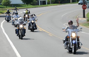 Members of Stilettos on Steel, a women’s motorcycle riding group, cruise up Southampton Road on a recent run to Hogback Mountain in Vermont. (Photo © 2016 Carl E. Hartdegen)