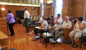 Westfield School District staff and School Committee members listen to the Finance Committee's recommendation at Tuesday's budget hearing. (Photo by Amy Porter)