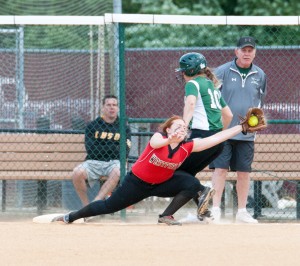 Westfield first baseman Grace Barnes stretches to make a fantastic play at the bag. (Photo by Bill Deren)