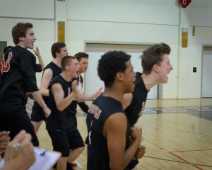 The Westfield Bombers erupt into celebration after defeating the West Springfield Terriers in a West Division 1 boys' volleyball tournament semifinal Thursday night. WHS advances to Monday's championship against the winner of Central-Agawam. (Photo by Marc St. Onge)