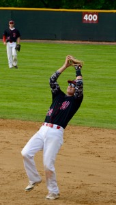 Westfield first baseman Sean Moorhouse squeezes his glove to secure an out on a pop fly. (Photo by Chris Putz)