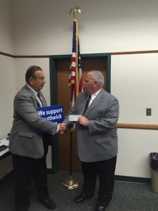 Republican Town Committee Chairman Bob Horacek presents Police Chief Dave Ricardi the $500 check. (Photo by Greg Fitzpatrick)