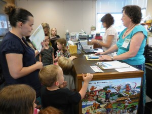 Children sign up for the summer reading program at the Huntington Public Library. (Photo by Amy Porter)