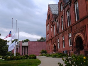 Flags fly at half mast at City Hall on Tuesday. (Photo by Amy Porter)