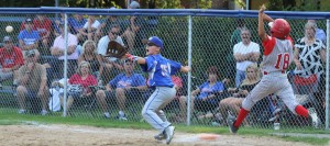 Westfield American's Aidan King attempts to record an out at first base against Pittsfield in a Little League Baseball sectional opener Wednesday night at Ralph E. Sanville Field. (Photo by Kellie Adam)