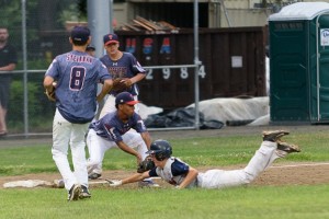 James Renaudette slides into a base to attempt the tag. (Photo by Marc St. Onge)
