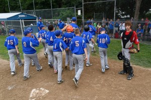 Kareem Zaghloul is congratulated by his teammates after his home run gave Westfield American the 4-3 lead. (Photo by Marc St. Onge