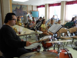 South Middle School band director Luke Baillargeon practices with summer band students for an upcoming concert this Friday, August 5, 6 p.m. at the Second Congregational Church. (Photo by Amy Porter)