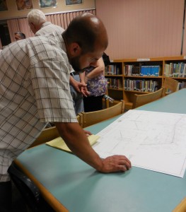 Westfield resident Chris Chabin studies plans following the information session on Wednesday. (Photo by Amy Porter)