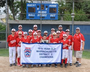 The Westfield National 11-Year-Old team poses for a picture with their championship banner. (Photo by Marc St. Onge)